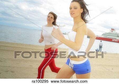 Two joggers on beach View Large Photo Image Stock Photography - Two joggers on beach. Fotosearch