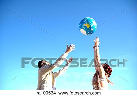 Picture - Two people playing ball. Fotosearch