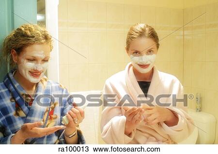 Stock Image - Two women with face masks. Fotosearch