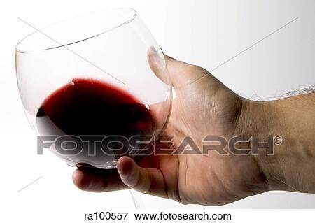 Wine glass in hand View Large Photo Image Stock Photo - Wine glass in hand. Fotosearch