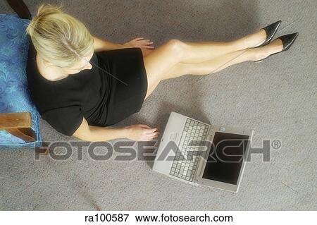 Woman beside laptop View Large Photo Image Stock Photo - Woman beside laptop. Fotosearch