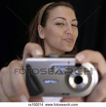 Woman taking photo View Large Photo Image Picture - Woman taking photo. Fotosearch