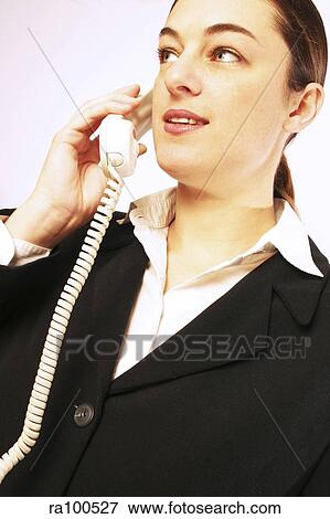 Stock Photo - Woman talking with phone. Fotosearch