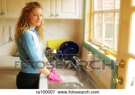 Woman washing up View Large Photo Image Stock Photo - Woman washing up. Fotosearch