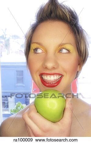 Woman with apple View Large Photo Image Stock Photo - Woman with apple. Fotosearch