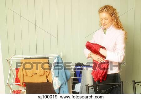 Woman with clothes washing View Large Photo Image Stock Photo - Woman with clothes washing. Fotosearch