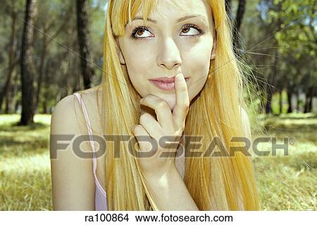 Young woman thinking View Large Photo Image Picture - Young woman thinking. Fotosearch