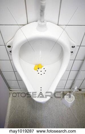 Stock Photo - A close up of a public urinal. Fotosearch