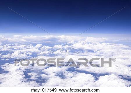 A cloudscape taken from an airplane View Large Photo Image Stock Photo - A cloudscape taken from an airplane. Fotosearch
