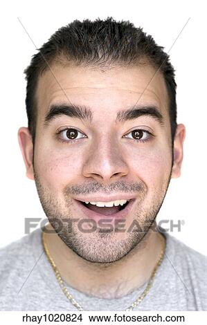 A headshot of a young man that is amazed or thrilled about something. View Large Photo Image Picture - A headshot of a young man that is amazed or thrilled about something.. Fotosearch