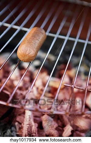 A hotdog on a grill View Large Photo Image Picture - A hotdog on a grill. Fotosearch