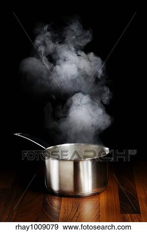 a pot with open lid with steam cloud over it View Large Photo Image Stock Photo - a pot with open lid with steam cloud over it . Fotosearch