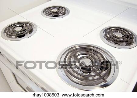 A white electric stove with four burners. View Large Photo Image Stock Image - A white electric stove with four burners.. Fotosearch