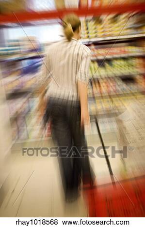 A woman shopping with zooming blur View Large Photo Image Stock Photo - A woman shopping with zooming blur. Fotosearch