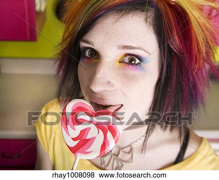 Alternative Girl in a Colorful Kitchen with a Heart Lollipop View Large Photo Image Stock Photo - Alternative Girl in a Colorful Kitchen with a Heart Lollipop. Fotosearch