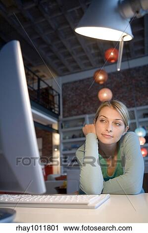 attractive blond woman working from home View Large Photo Image Stock Image - attractive blond woman working from home. Fotosearch