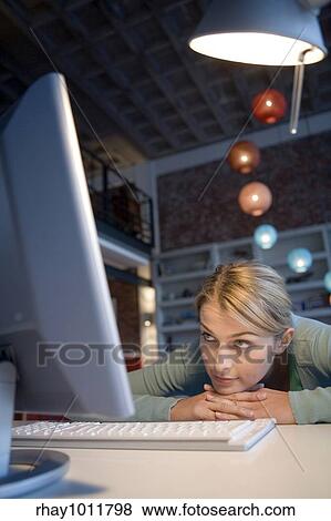 Stock Photo - attractive blond woman working from home. Fotosearch