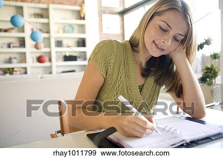 attractive blond woman working from home View Large Photo Image Stock Photo - attractive blond woman working from home. Fotosearch