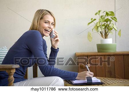 attractive blond woman working from home View Large Photo Image Stock Photograph - attractive blond woman working from home. Fotosearch