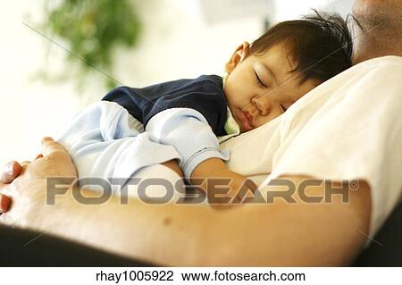 Baby asleep on his father's chest. View Large Photo Image Stock Image - Baby asleep on his father's chest.. Fotosearch