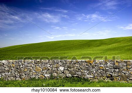 Beautiful green meadow with a old Stone wall View Large Photo Image Picture - Beautiful green meadow with a old Stone wall . Fotosearch