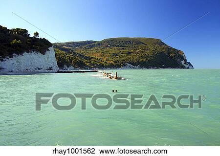 "Beautiful landscape from the Urbani beach in Sirolo, Italy. The beach has been awarded the Blue Flag from the EU for its pure water and clean surroundings. " View Large Photo Image Stock Image - "Beautiful landscape from the Urbani beach in Sirolo, Italy. The beach has been awarded the Blue Flag from the EU for its pure water and clean surroundings. ". Fotosearch
