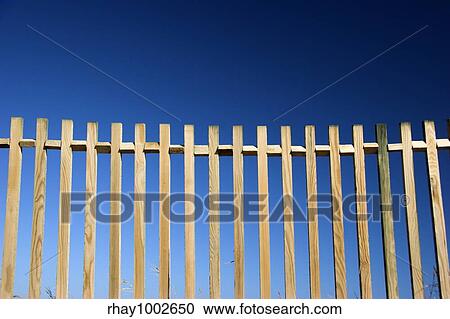 Stock Image - Beautiful wood fences over a great blue sky. Fotosearch
