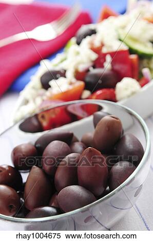 Stock Photography - Black kalamata olives and greek salad with feta cheese. Fotosearch