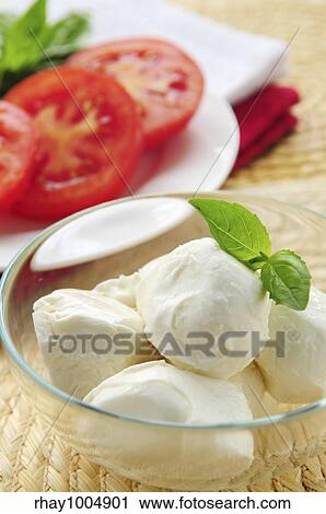 "Bocconcini cheese, basil and sliced tomatoes - ingredients of traditional italian cuisine" View Large Photo Image Stock Image - "Bocconcini cheese, basil and sliced tomatoes - ingredients of traditional italian cuisine". Fotosearch