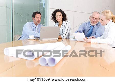 Stock Photo - business people in a meeting. Fotosearch