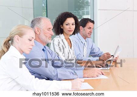 Stock Photograph - business people in a meeting. Fotosearch