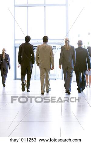 Stock Image - business people leaving office. Fotosearch