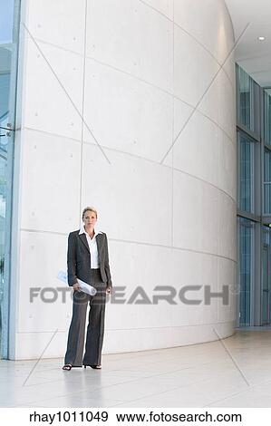 business woman standing outside building View Large Photo Image Stock Photo - business woman standing outside building. Fotosearch