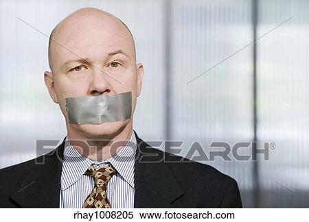 Businessman silenced with duct tape over his mouth View Large Photo Image Stock Photography - Businessman silenced with duct tape over his mouth. Fotosearch
