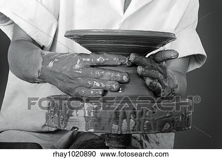 Close-up picture of a potter works a potter's wheel View Large Photo Image Stock Image - Close-up picture of a potter works a potter's wheel. Fotosearch