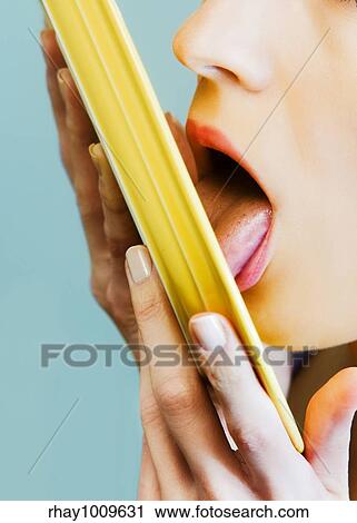 close up portrait of a woman cleaning up a plate with her tongue View Large Photo Image Stock Image - close up portrait of a woman cleaning up a plate with her tongue. Fotosearch