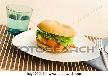 Cold smoked salmon bagel on the table View Large Photo Image Stock Image - Cold smoked salmon bagel on the table. Fotosearch