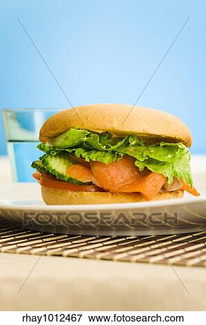 Stock Photo - Cold smoked salmon bagel on the table. Fotosearch
