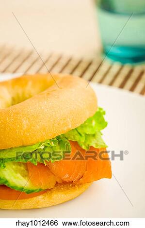 Cold smoked salmon bagel on the table View Large Photo Image Stock Photograph - Cold smoked salmon bagel on the table. Fotosearch