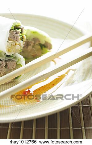 Stock Photograph - Cold spring rolls with sweet chili sauce. Fotosearch