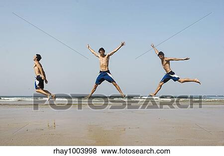 Combinations of tree picture in one of a young man jumping on the beach View Large Photo Image Stock Photo - Combinations of tree picture in one of a young man jumping on the beach. Fotosearch