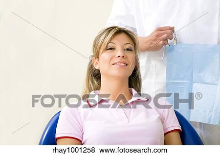 dentist and his patient in examination room. Copy space View Large Photo Image Stock Photo - dentist and his patient in examination room. Copy space. Fotosearch