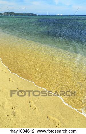 Footprints on the golden sand of Pampelonne beach near St. Tropez in French Riviera View Large Photo Image Stock Image - Footprints on the golden sand of Pampelonne beach near St. Tropez in French Riviera. Fotosearch