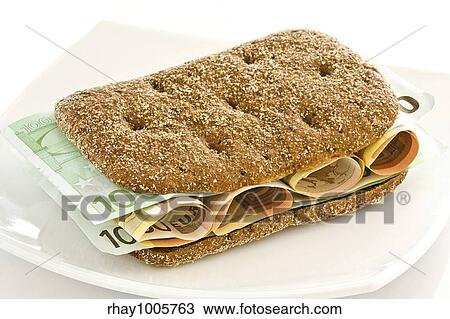 Fresh bread with a layer of monetary denominations insideFresh bread with a layer of monetary denominations inside View Large Photo Image Stock Image - Fresh bread with a layer of monetary denominations insideFresh bread with a layer of monetary denominations inside. Fotosearch