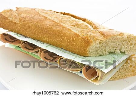 Fresh white loaf with a layer of monetary denominations insideFresh white loaf with a layer of monetary denominations inside View Large Photo Image Stock Image - Fresh white loaf with a layer of monetary denominations insideFresh white loaf with a layer of monetary denominations inside. Fotosearch