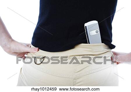 Girl hiding cameraphone in her back View Large Photo Image Stock Photo - Girl hiding cameraphone in her back. Fotosearch