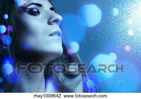 Stock Image - gloomy fashion portrait with flares. Fotosearch