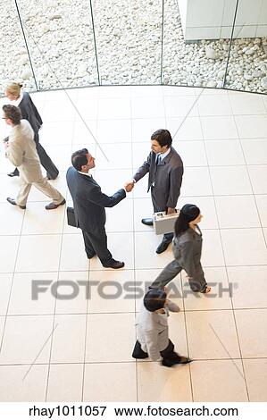 Stock Photo - group of business people shot from above. Fotosearch