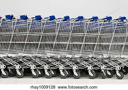 grouped shopping carts row View Large Photo Image Stock Photo - grouped shopping carts row. Fotosearch