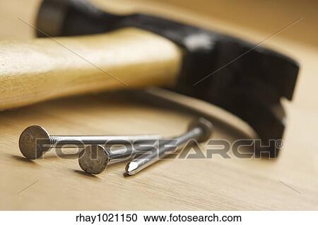 Hammer and Nails Abstract on Wood Background. View Large Photo Image Stock Image - Hammer and Nails Abstract on Wood Background.. Fotosearch